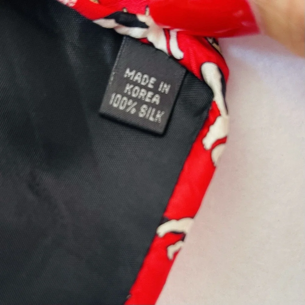 The Big Dogs 100% silk tie pattern of dogs wearing antlers on‎ a red background
